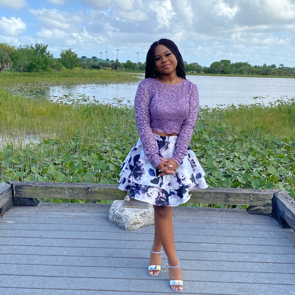 Two piece outfit worn once. Lace purple top with flower skirt. Smoke free home.